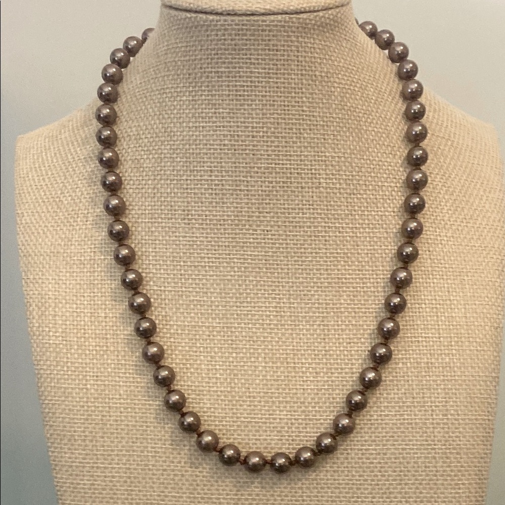 Faux pearl necklace.